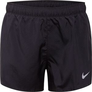 Sportovní kalhoty 'FAST' Nike černá / bílá