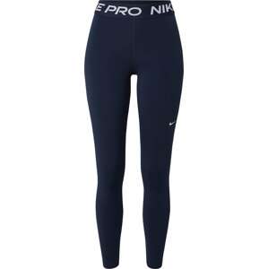 Sportovní kalhoty Nike námořnická modř / bílá